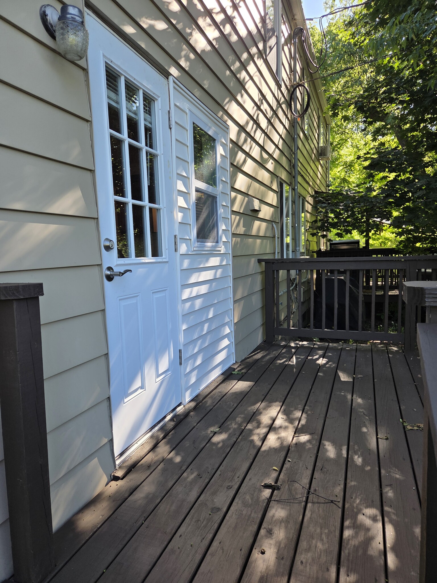 Rear deck with new access door. - 102 Stonecrest