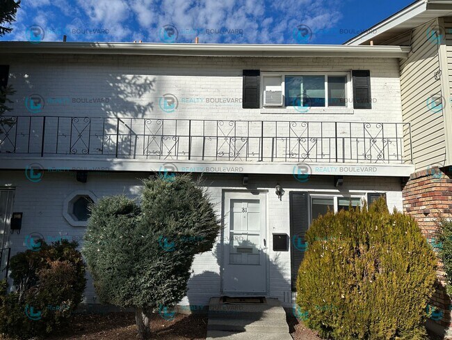 Building Photo - 2-bed, 2-bath, 2-story townhome with pool and park like setting outside the front door.