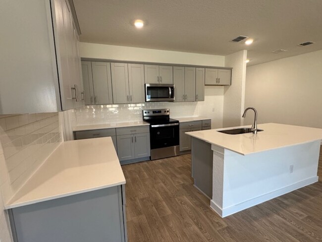 Building Photo - BRAND NEW 4 BR / 2 BA with THREE-CAR GARAG...