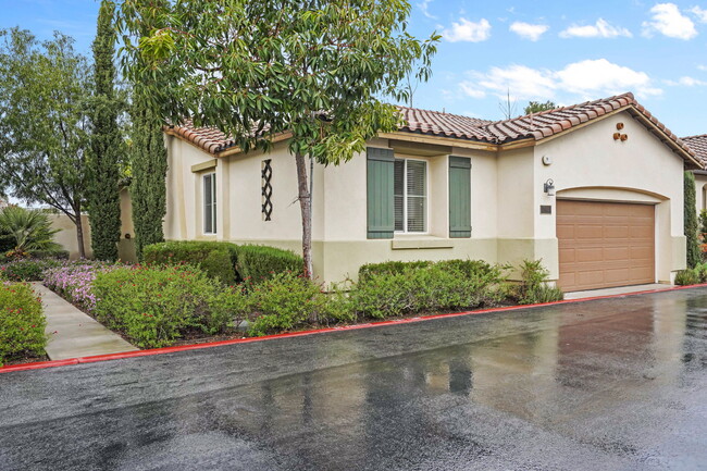 lush gardens surround the home - 4720 E Washington Ave