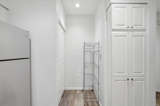 Building Photo - Commuter’s Paradise! Ground-Level 2BR Condo  Welcome home to this stunning, sun-filled 2-bedroom ...