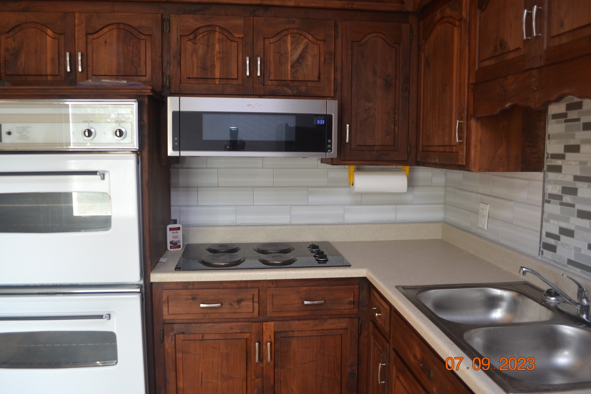 One last view of the custom cabinets, new backsplash and counter top. - 15314 Fuller Ave