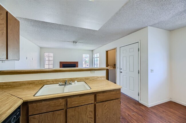 Building Photo - 2nd Story 2-Bed Condo with Tile Fireplace