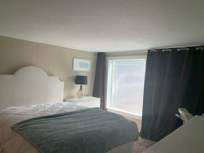 Bottom floor suite. Separate entrance and private bath. Blackout curtains. - 110 NE 40th St