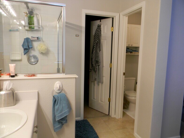 Shower, toilet closet and door to spacious walk-in closet! - 5835 S Harlan St