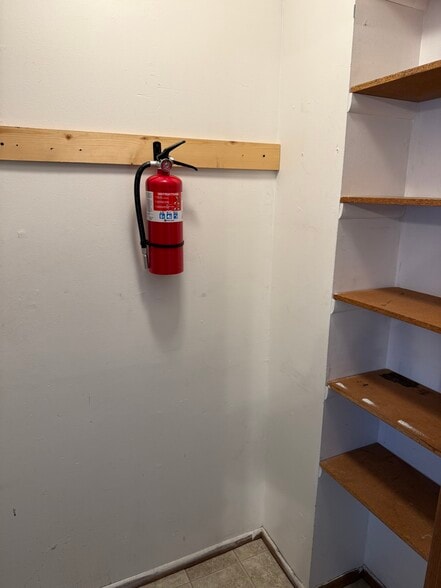 storage and entry to basement - 114 W Spring St