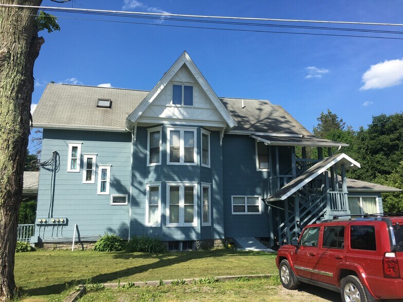 Middle set of windows is apartment - 91 S Chenango St