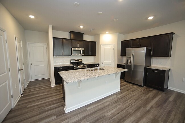Building Photo - Beautiful 3 Bed+Bonus+2 Car Garage Townhome in New Wake Forest Community