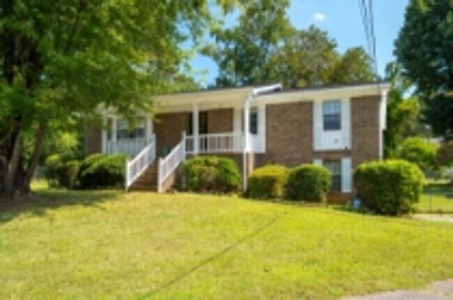 Building Photo - This beautifully updated brick home in Har...