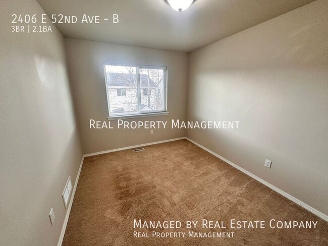 Building Photo - 2406 E 52nd Ave