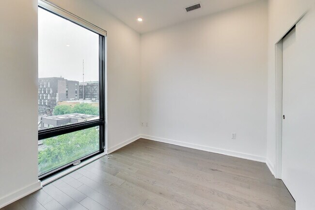 Building Photo - Top floor residence in elevator building with sweeping views.