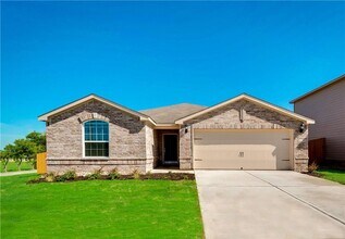Building Photo - This lovely 4 bedroom home features a large family room with lots of light.