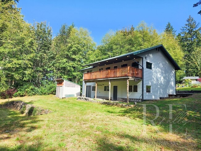 Building Photo - Vaulted Ceilings, Unique Designer Kitchen & Expansive Half-Acre Setting with Flexible Living Spaces