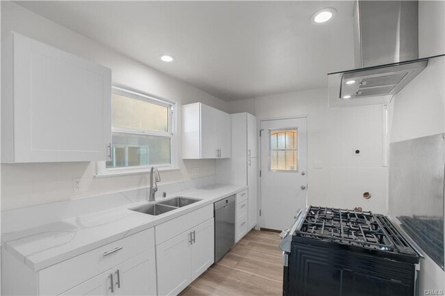 Building Photo - Welcome to this inviting 3 bedroom, 2 bath residence tucked away on a peaceful street in the hear...