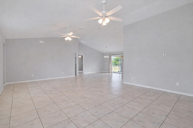 Building Photo - Spacious Three-Bedroom Home with Open Floor Plan, Large Yard & Screened Patio