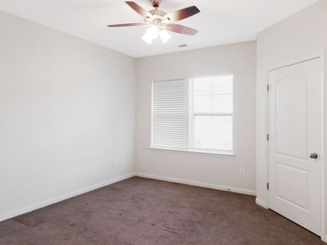 Building Photo - Pet Friendly Condo with Deck and 1 Car Garage