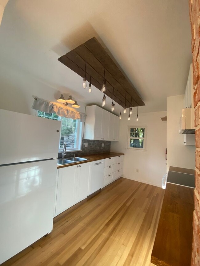 Building Photo - Perry District Gem – Move-In Ready 3 plus Bed / 2 Bath Brick Home with Finished Basement & 2-Car ...