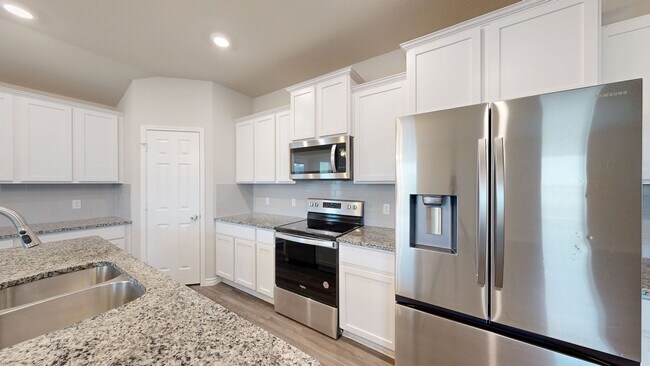 Building Photo - Discover this spacious 4-bedroom, 2-bath home with 3 CAR GARAGE!!!