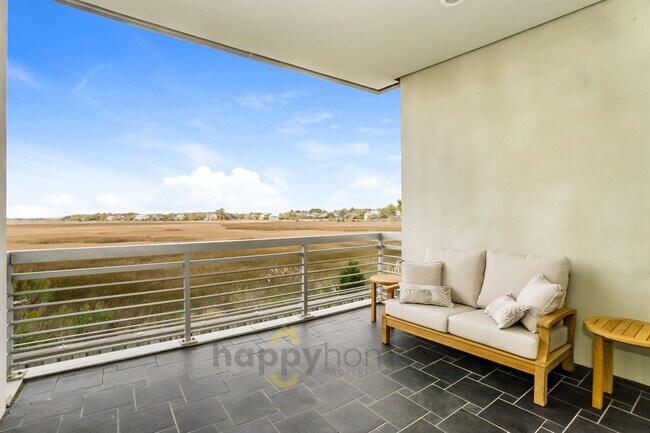 Building Photo - Waterfront Oasis: Fully Furnished 1BR/1.5BA with Marsh Views