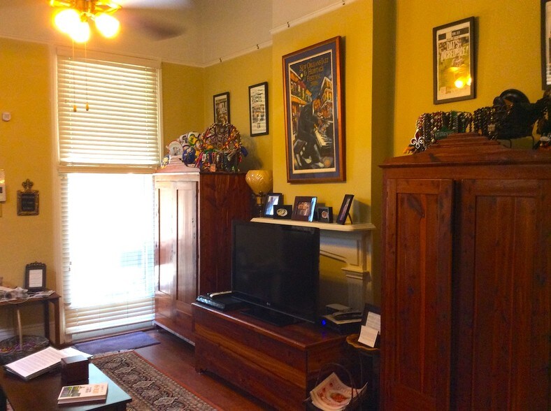 Den with antique armoires and 52" TV. - 4634 Orleans Ave