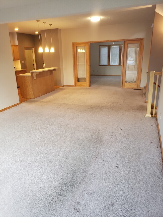 Great room thru Dining area to first floor Master - 4523 State Line Rd