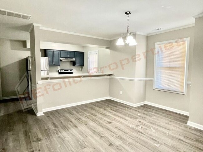 Building Photo - Carpetless 2 BD 1.5 Bath 2 Story Quadplex ...