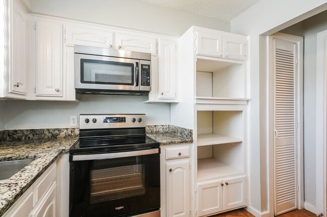 Building Photo - 4 BR/2BA | Updated Single Family Home | Gorgeous hardwoods | Storage attic!