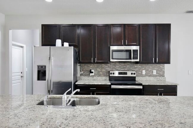 Building Photo - Stylish 4/3 Home with Covered Patio & Gara...