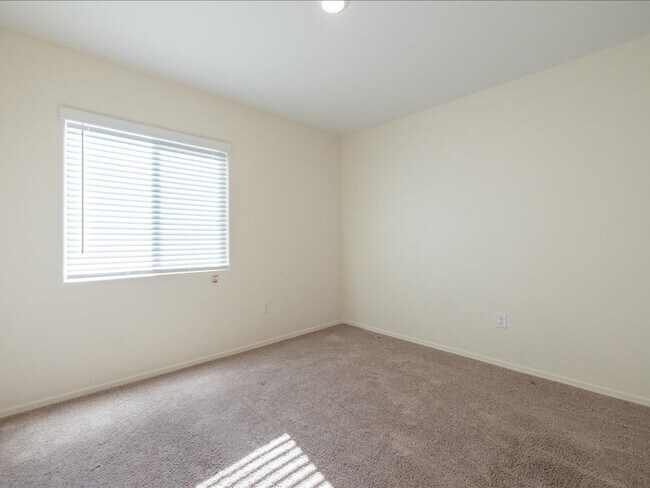 Building Photo - Spacious 4-Bedroom Home with Open Layout & Turf Backyard