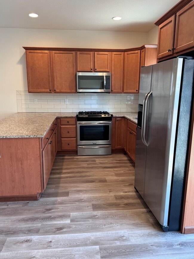 Building Photo - Beautiful Home with LVP Flooring, SS Appliances, Garage, W/D, Fenced Yard, LARGE Master & MORE!
