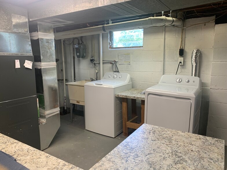 Laundry and folding area with New Washer and Dryer - 150 S Lecato Ave