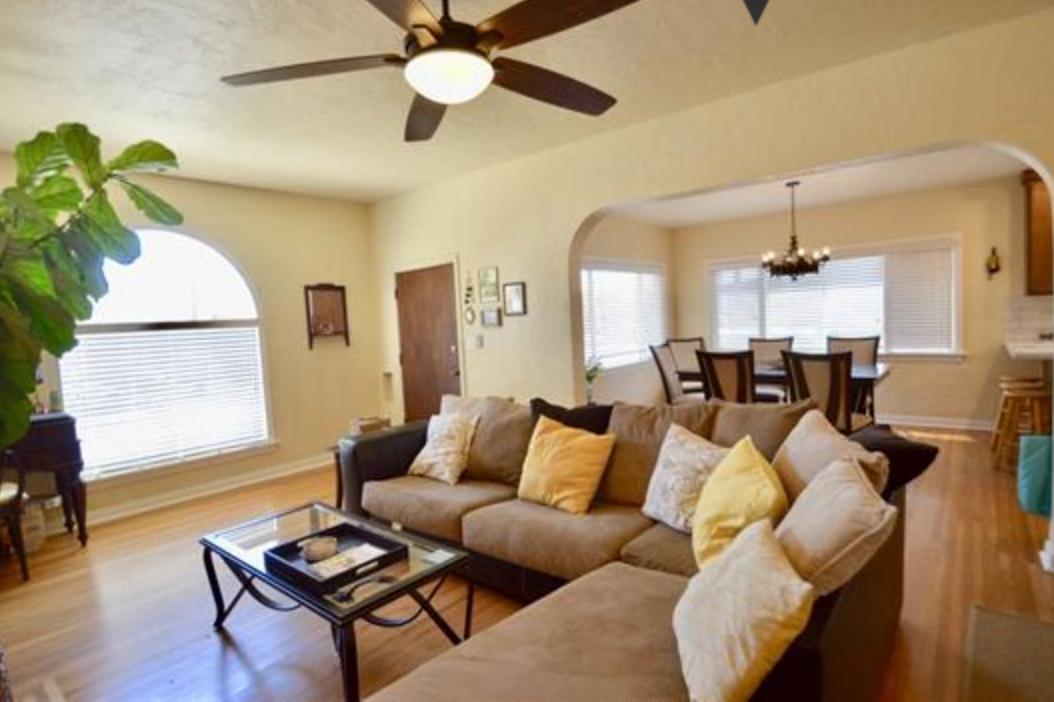 Living Room with view of large window facing the street. Lots of natural light, and blinds to provide options for privacy - 4770 Bancroft St