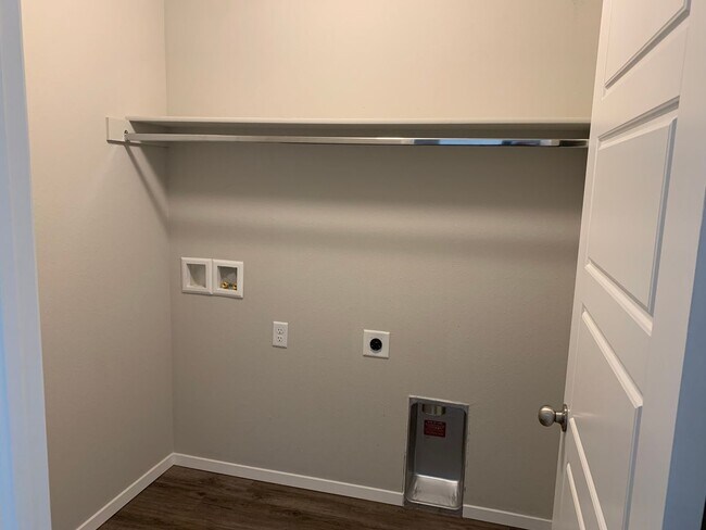 Building Photo - This well-designed 4-bedroom home has a split floor plan that gives the feeling of space.