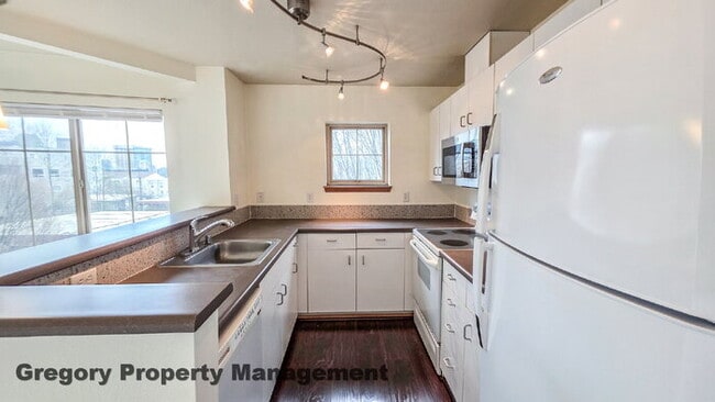Building Photo - Sunny Capitol Hill 2 BR 1.5 BA Condo with Garage Parking Included & Skyline Views!