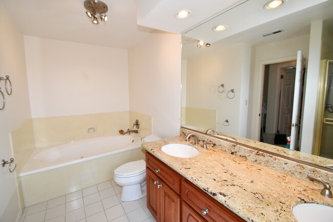 Master Bath with jacuzzi tub and separate stand up shower. - 1920 Havemeyer Ln