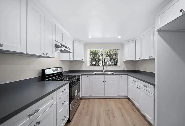 Primary Photo - "Charming 3-Bed Townhouse with Granite Countertops & Hardwood Floors in Santa Ana!"