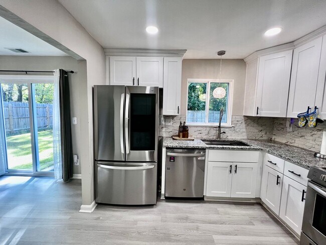 Building Photo - Come see this FULLY renovated two-story tr...