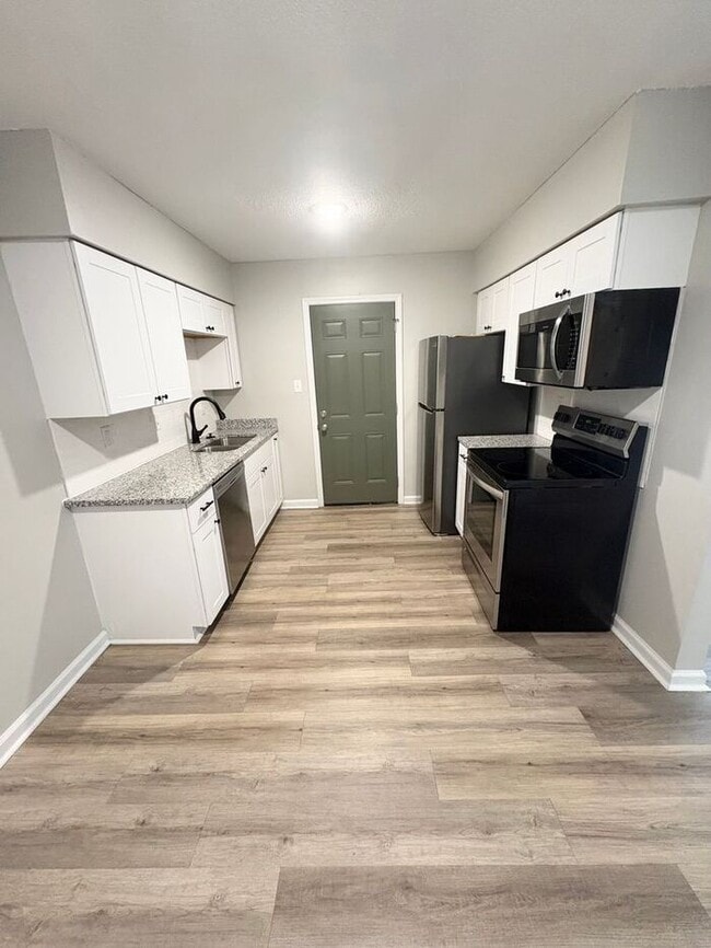 Primary Photo - Steps from UofM & Highland Strip – First-Floor 2BR Apartment at The Den!