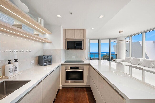 Building Photo - 6899 Collins Ave