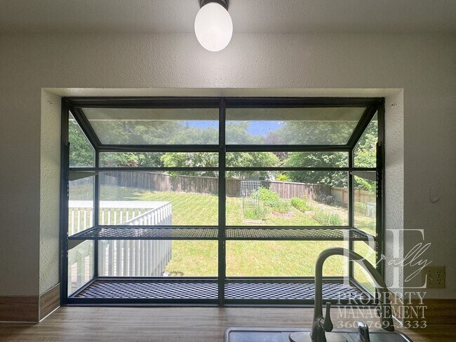 Building Photo - Spacious Poulsbo Home with Large Basement, Fenced Yard & Garden Space