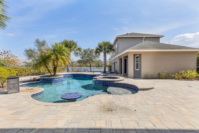 Building Photo - Luxury Waterfront Pool Home in Laureate Park | 4BR + Water Views