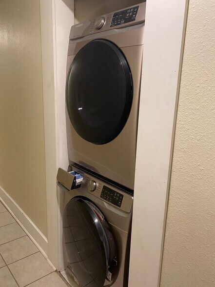 Shared laundry in main hall of building - two units share. - 919 Massachusetts St