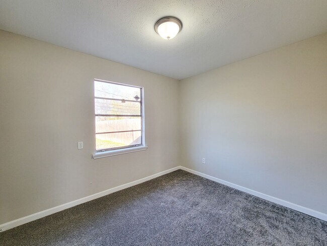 Building Photo - REMODELED/ UPDATED 4 BEDROOM 2 BATH WITH C...