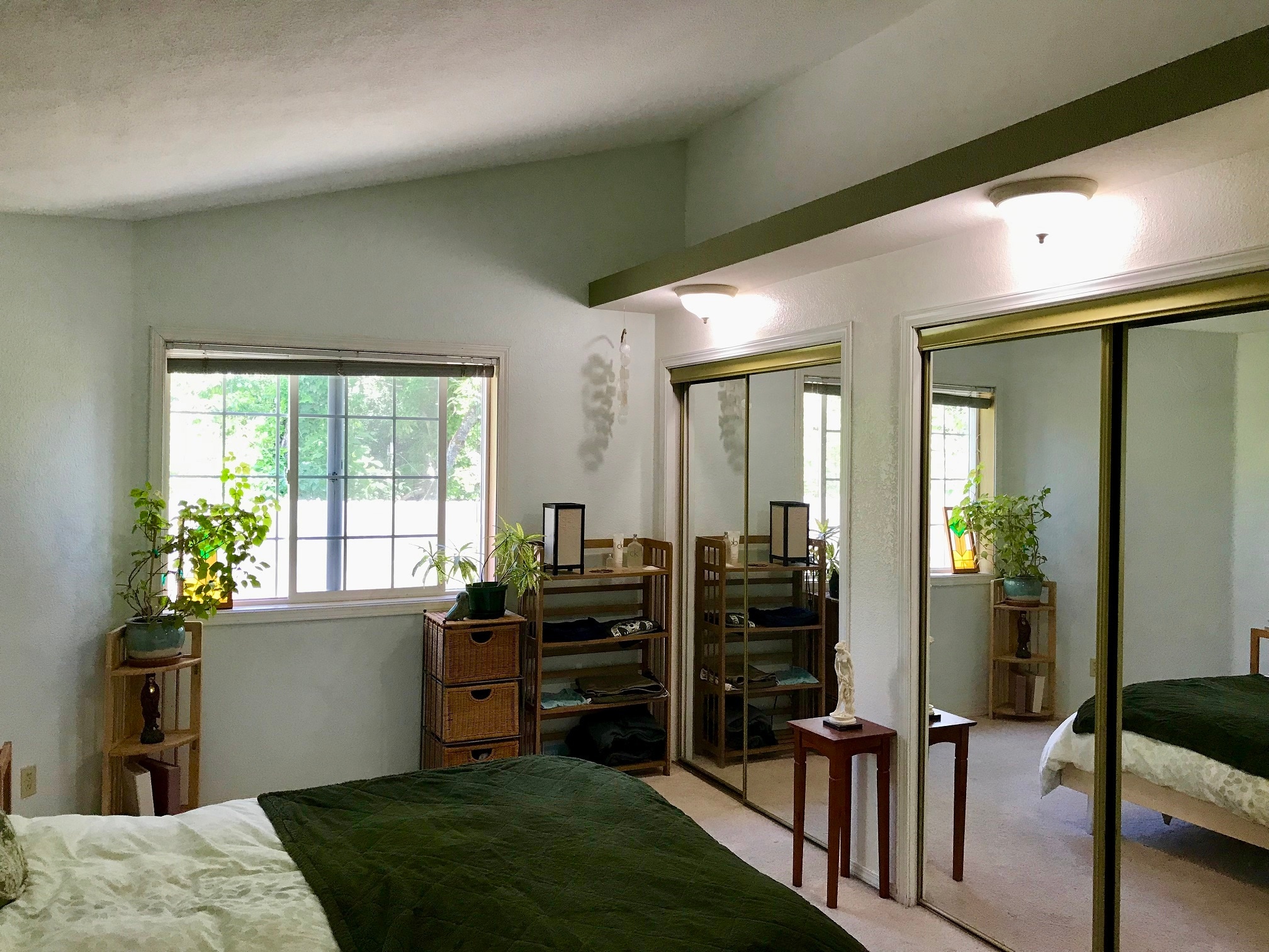 View of the primary bedroom, which has an attached bathroom and shower - 885 Randall St