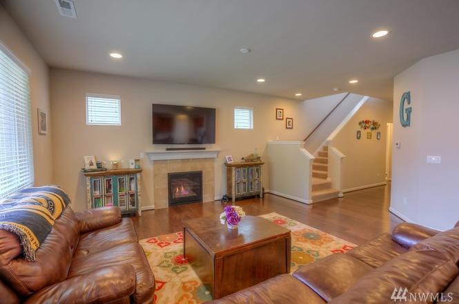 Family room, and gas fireplace - 8828 Jayden Ln NE