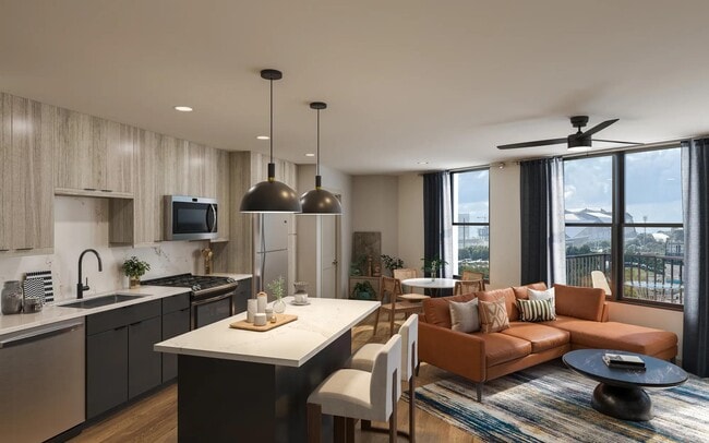 Gourmet kitchens with quartz countertops, custom cabinetry with soft close, and large chefs island. - Modera Westside Trail