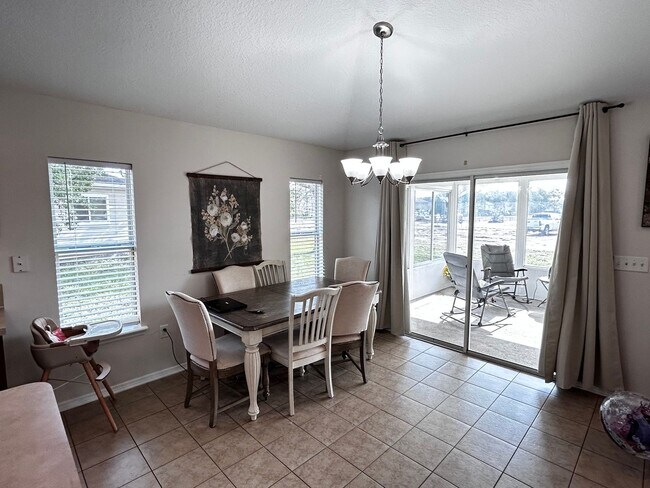 Building Photo - Newer Build 3/2 with Fenced in yard minute...
