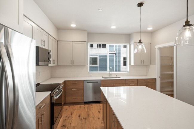 Building Photo - NEW CONSTRUCTION – Stylish 4-Bedroom Townh...