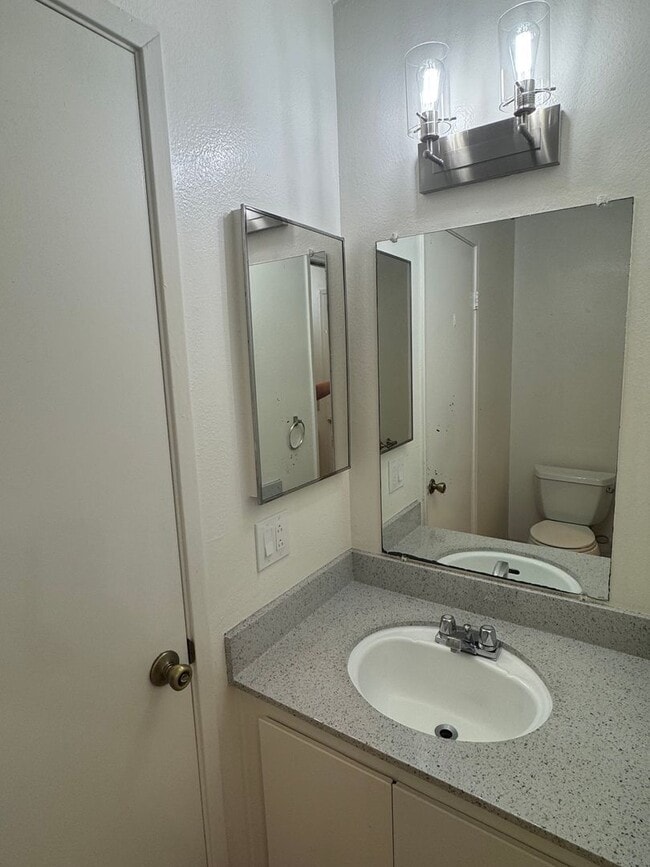 Building Photo - Upstairs two-bedroom 1/12 bath condo avail...