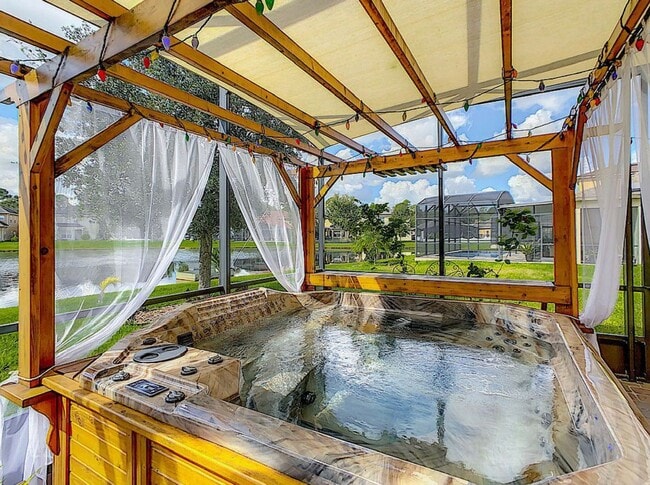 Building Photo - Luxury Living in Woodland Lakes Preserve: Fully-Furnished